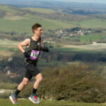 Man running marathon on countryside trail
